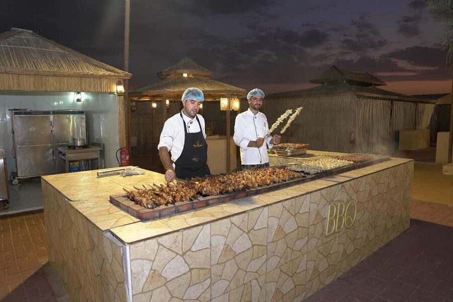 Dubai: Desert Safari, Camel Ride, Quad Bike & BBQ Dinner - Dinner Under the Stars: Buffet BBQ With Drinks Included
